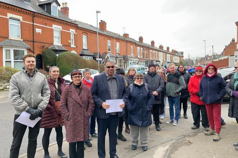 Tahir Ali with residents on Institute Road in 2023.