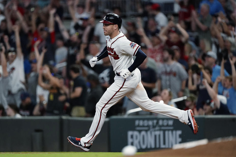 Atlanta Braves' Freddie Freeman rounds the bases after hitting a home run during the sixth inning of the team's baseball game against the Boston Red Sox on Wednesday, June 16, 2021, in Atlanta. (AP Photo/John Bazemore)