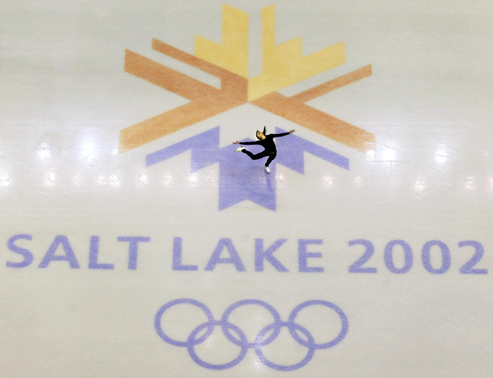 FILE - This Feb. 8, 2002, file photo, shows U.S. champion Michelle Kwan practicing for the women's short program for the Winter Olympic Games at the Salt lake Ice Center in Salt Lake City. Salt Lake City got the green light to bid for an upcoming Winter Olympics most likely for 2030 in an attempt to bring the Games back to the city that hosted in 2002 and provided the backdrop for the U.S. winter team's ascendance into an international powerhouse. (AP Photo/Doug Mills, file)