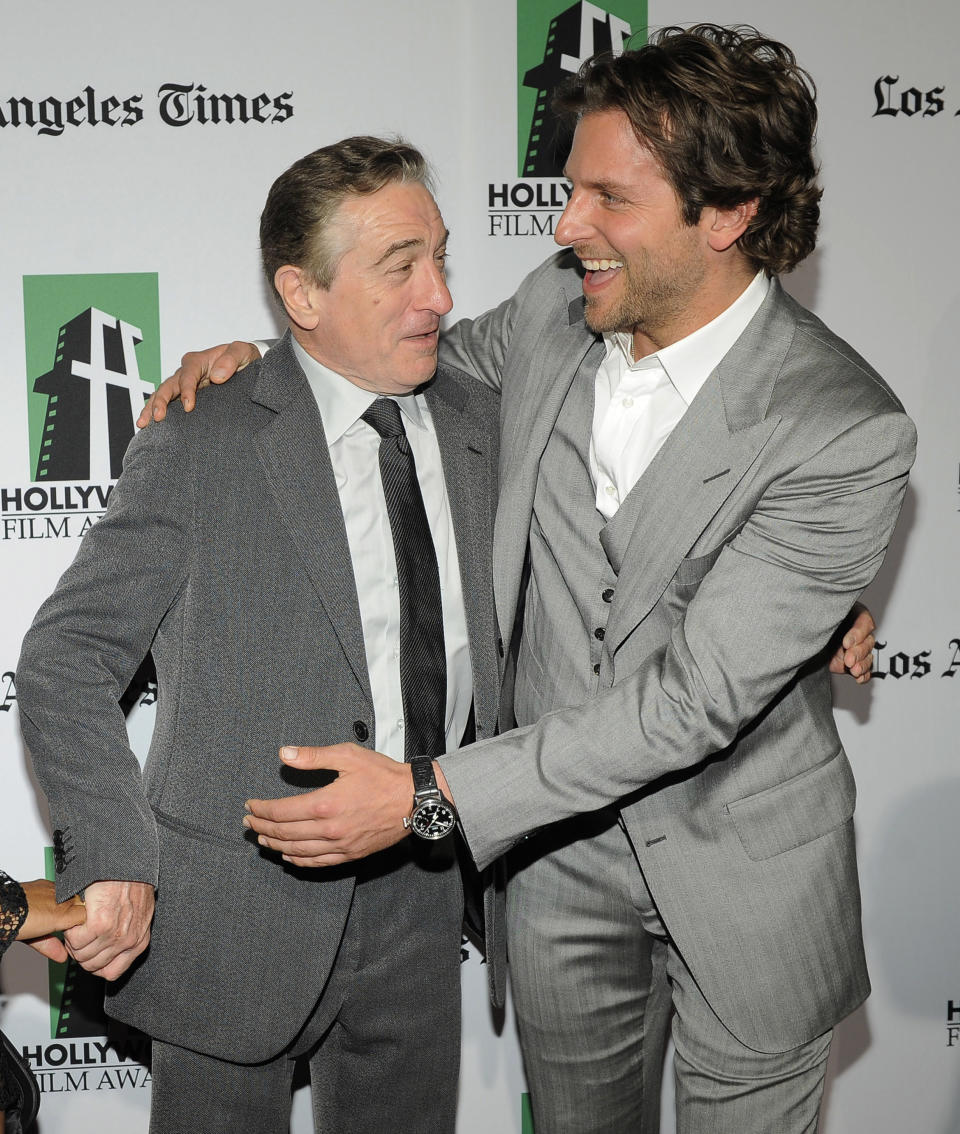 Robert De Niro, left, recipient of the Hollywood Supporting Actor Award, is greeted by Bradley Cooper, recipient of the Hollywood Actor Award, at the 16th Annual Hollywood Film Awards Gala on Monday, Oct. 22, 2012, in Beverly Hills, Calif. De Niro and Cooper are cast members in the forthcoming film "Silver Linings Playbook." (Photo by Chris Pizzello/Invision/AP)