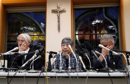 Tetsuro Saito, head of Caritas Gakuen School group, Teiko Naito, head of Caritas Gakuen Elementary School, and assistant principal Satoru Shitori, whose students were victims by a stabbing, attend a news conference at the school in Kawasaki, Japan, May 28, 2019. REUTERS/Issei Kato