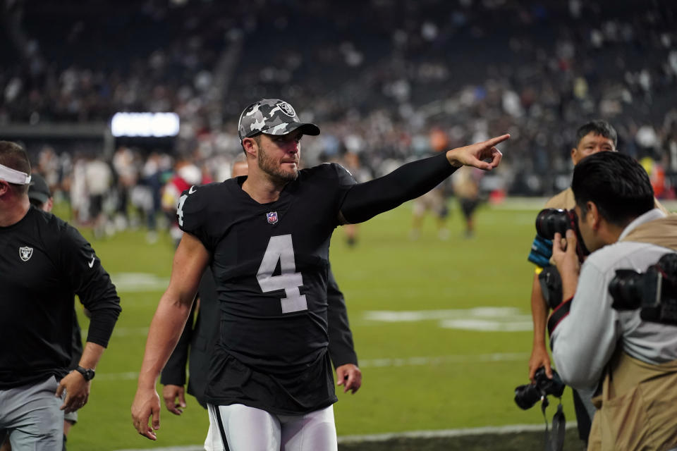 Las Vegas Raiders quarterback Derek Carr (4) points to the stands after an NFL preseason football game against the New England Patriots, Friday, Aug. 26, 2022, in Las Vegas. The Raiders beat the Patriots 23-6. (AP Photo/John Locher)