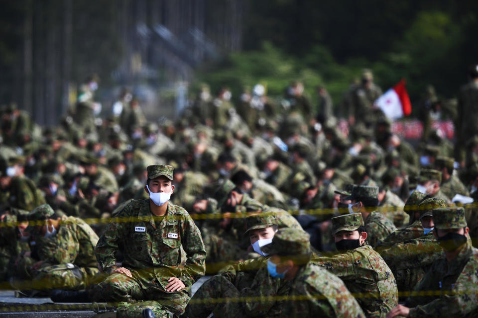 Members of Japanese Ground Self-Defense Forces attend the annual live fire exercise at the Higashi-Fuji firing range in Gotemba in Shizuoka prefecture, Japan, Saturday, May 23, 2020.(Charly Triballeau/Pool Photo via AP)