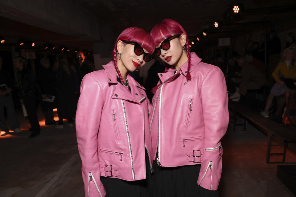 Amiaya pose for a photographer before the Dries Van Noten ready-to-wear Spring/Summer 2023 fashion collection presented Wednesday, Sept. 28, 2022 in Paris. (Photo by Vianney Le Caer/Invision/AP)