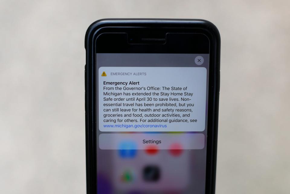 An emergency alert from Michigan's governor appears on a cellphone April 9, 2020.