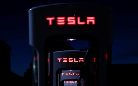 Tesla Model Y charging UK - Credit: MIKE BLAKE&nbsp;/REUTERS