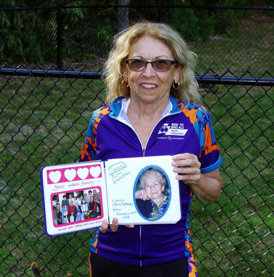 Ann Whaley-Tobin, of Easton, on Wednesday, July 13, 2022,  holds a photo of her mother, who died of Alzheimer's disease. Whaley-Tobin got into bike riding in her 50s and takes rides with friends and riding groups to raise money for Alzheimer's research.
