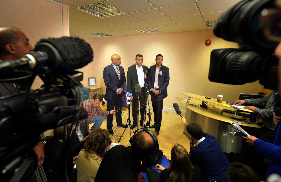 Solicitor Prakash Patel, left, Asok Hindocha, center, the uncle of Anni Dewani and Anish Hindocha, the brother of Anni Dewani speak at a press conference in central London, Monday, April 7, 2014. Anni Dewani was found shot dead in an abandoned taxi in Cape Town's Gugulethu township in November 2010. Her husband Shrien Dewani has spent years fighting extradition over the death of his 28-year-old bride, lawyers for the 34-year-old businessman say he suffers from post-traumatic stress and depression and is unfit to stand trial. But last month Britain’s High Court rejected his grounds for appeal. He is expected to be put on a flight to Cape Town Monday, and South African officials say he will appear in court there Tuesday. The Anni Dewani’s brother, Anish Hindocha, said the extradition brought them “one step closer” to justice. (AP Photo/John Stillwell, PA Wire) UNITED KINGDOM OUT - NO SALES - NO ARCHIVES