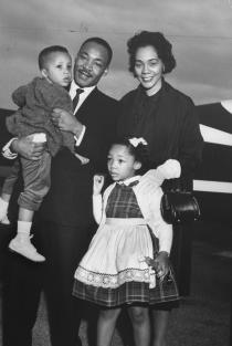 Dr. Martin Luther King Jr. holding his son Martin III as his daughter Yolanda and wife Coretta greet him at the airport upon his release from Georgia State prison after incarceration for leading boycotts.