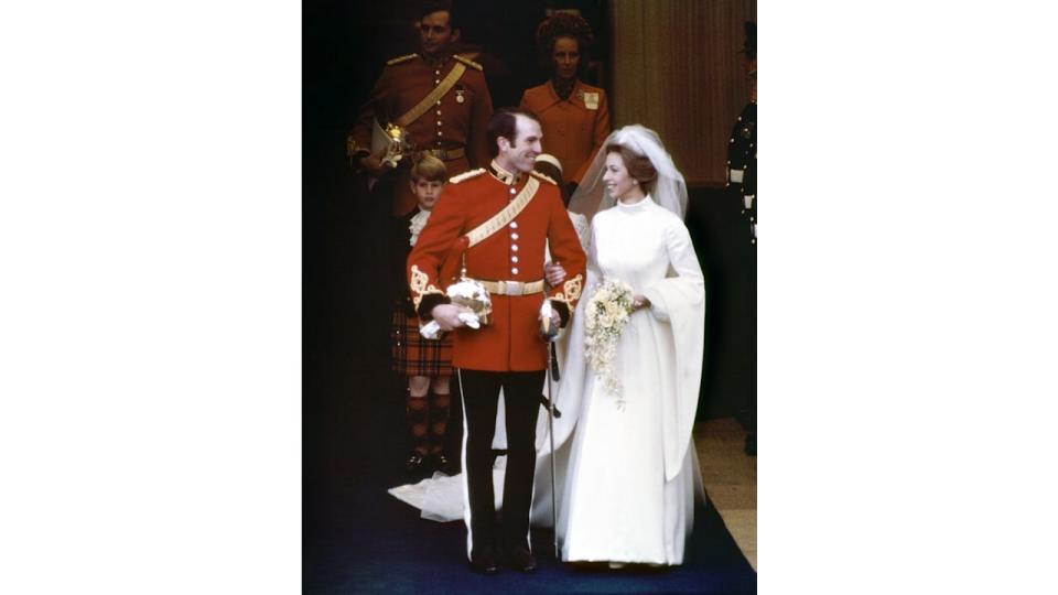 Princess Anne and Captain Mark Phillips smiling at each other while leaving the west door of Westminster Abbey in London after their wedding ceremony.