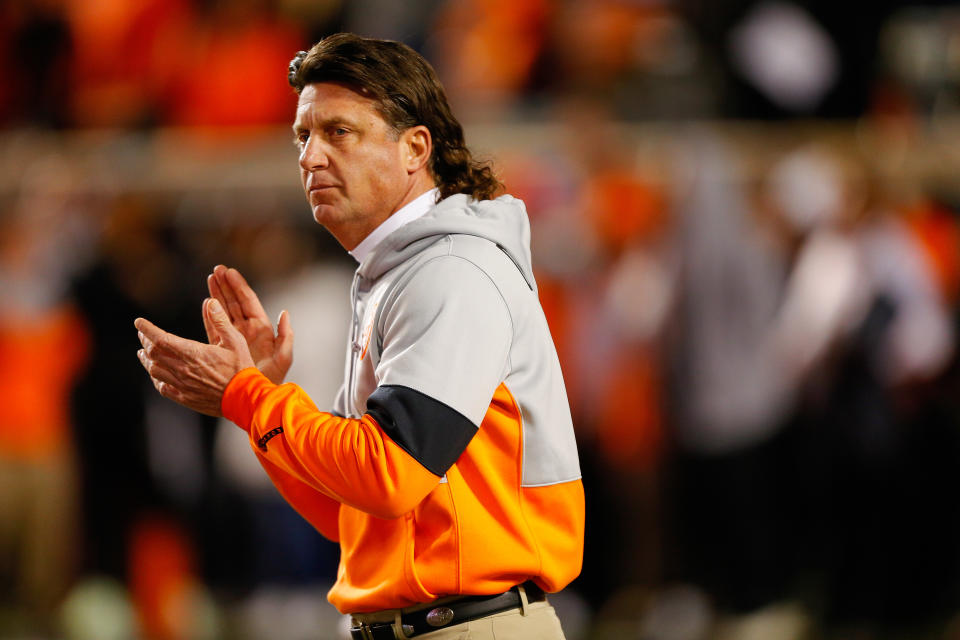 STILLWATER, OK - NOVEMBER 30:  Head coach Mike Gundy of the Oklahoma State Cowboys encourages his team before Bedlam against of the Oklahoma Sooners on November 30, 2019 at Boone Pickens Stadium in Stillwater, Oklahoma.  OU won 34-16.  (Photo by Brian Bahr/Getty Images)