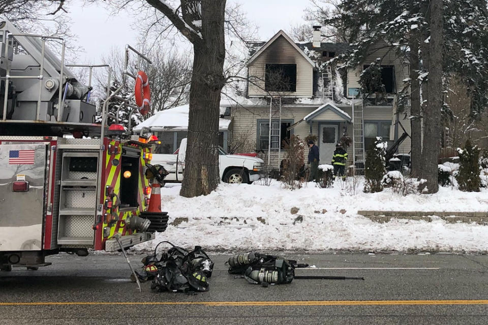 Des Plaines firefighters work at the scene of a house fire on the 700 block of W. Oakton that claimed the lives of 5 people on Wednesday morning, Jan. 27, 2021, in Des Plaines, Ill. (Mark Welsh/Daily Herald via AP)