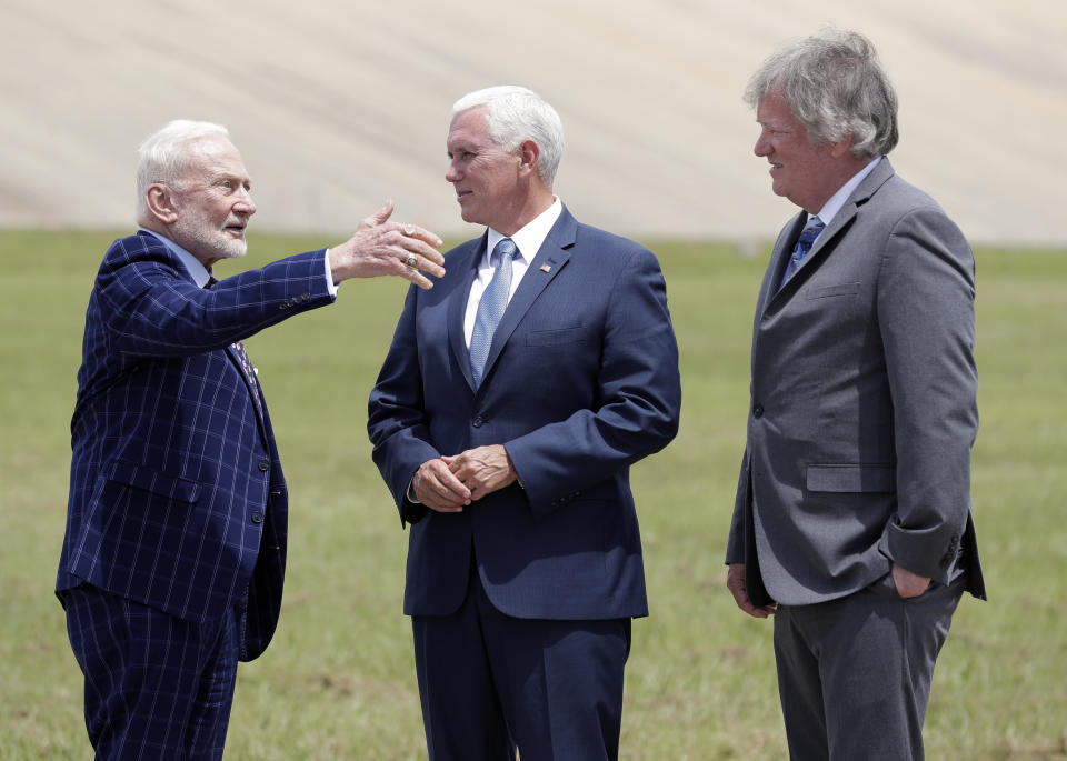 Apollo astronaut Buzz Aldrin, left, talks with Vice President Mike Pence, center, and Rick Armstrong, son of Apollo 11 astronaut Neil Armstrong as they gather at pad 39a the Kennedy Space Center where the launch of Apollo 11 took place 50 years ago on this anniversary of the moon landing, Saturday, July 20, 2019, in Cape Canaveral, Fla. (AP Photo/John Raoux)