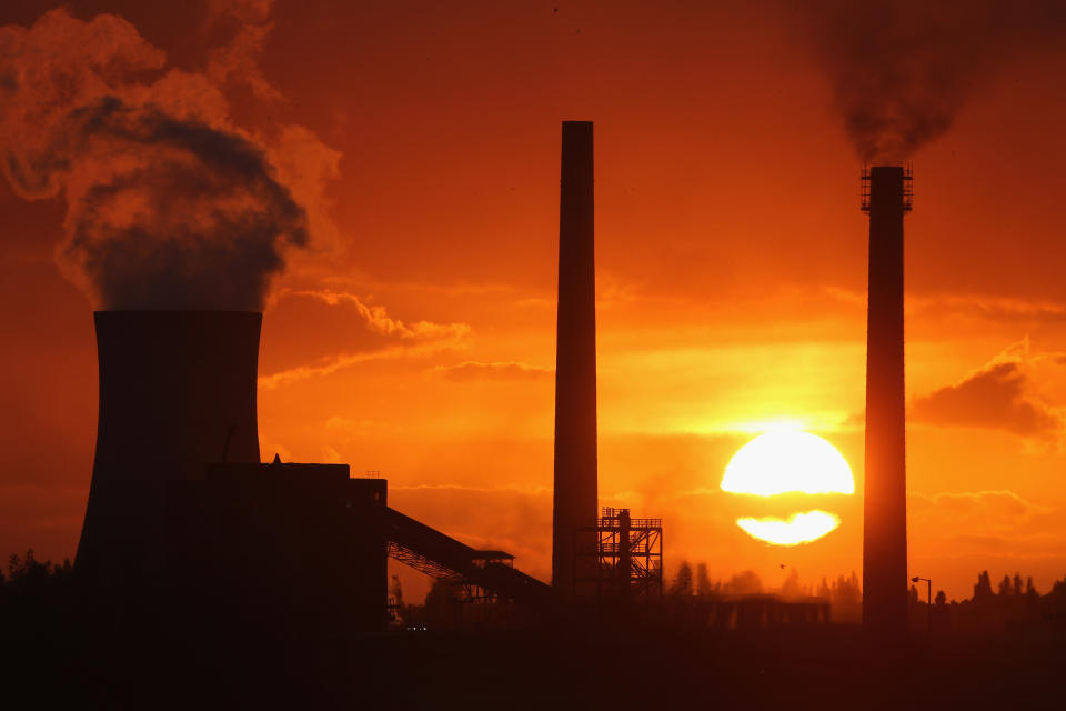 SCUNTHORPE, ENGLAND - OCTOBER 19:  The sun sets behind the Tata Steel processing plant at Scunthorpe which may make 1200 workers redundant on October 19, 2015 in Scunthorpe, England. Up to one in three workers at the Lincolnshire steel mill could lose their jobs alongside workers at other plants in Scotland. Tata Steel UK  is due to announce the Scunthorpe job losses this week.  (Photo by Christopher Furlong/Getty Images)