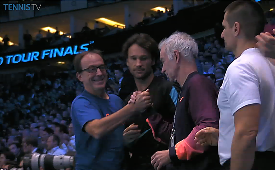Just like old times: McEnroe joined coaches Riccardo Piatti and Carlos Moyá in support of Raonic Thursday in London. (From TennisTV.com)