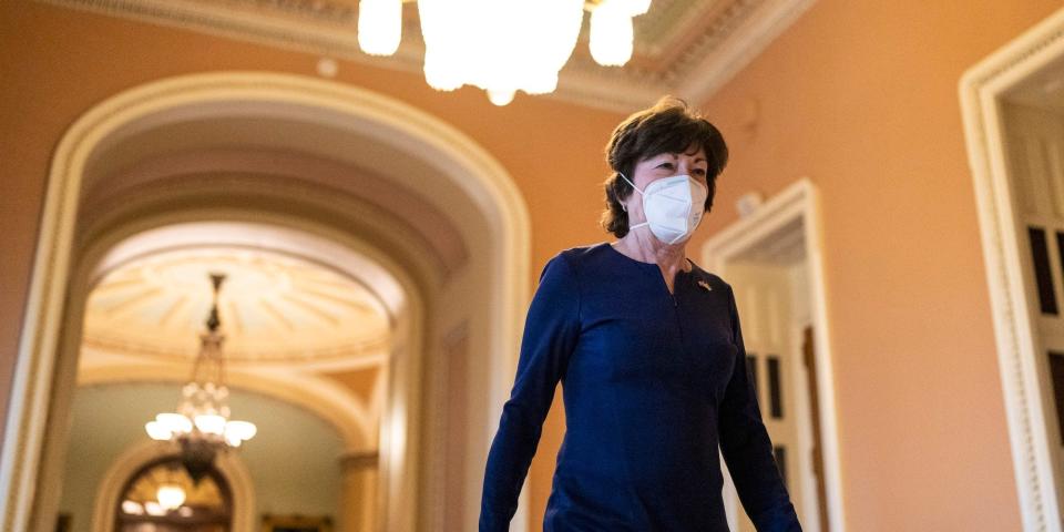 Republican Sen. Susan Collins, wearing a KN-95 mask, exits the Senate chamber on April 7, 2022.