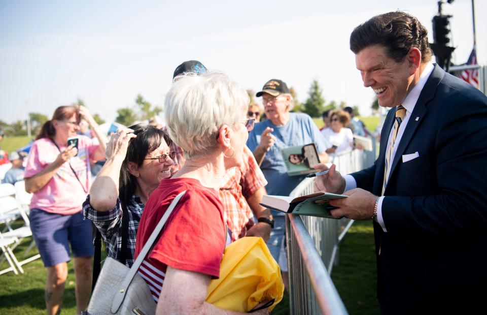 Bret Baier, Fox News Channel chief political anchor, autographs his book after speaking to the crowd during the Freedom Forum, First Amendment Festival at Discovery Park of America in Union City, Tenn., Saturday, Sept. 24, 2022.