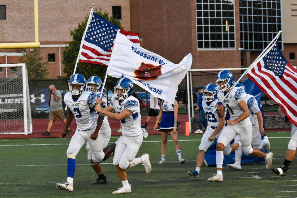 Pleasant Valley football players run out onto the field in East Stroudsburg before their game against East Stroudsburg South on Saturday, Sept. 18, 2021. South defeated PV, 36-14.