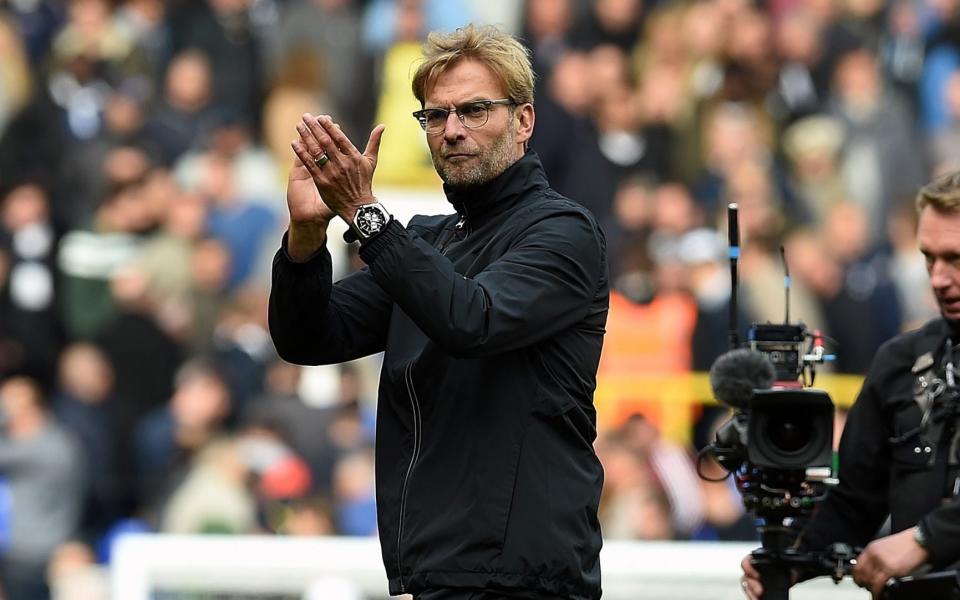 urgen Klopp manager of Liverpool shows his appreciation to the fans at the end during the Barclays Premier League match between Tottenham Hotspur and Liverpool