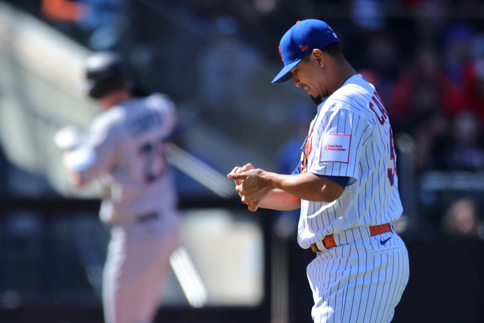 NEW YORK, NEW YORK - APRIL 09: Carlos Carrasco #59 of the New York Mets reacts as Garrett Cooper #26 of the Miami Marlins rounds third base after Cooper hit a two-run home run in the fifth inning at Citi Field on April 09, 2023 in New York City. (Photo by Mike Stobe/Getty Images)