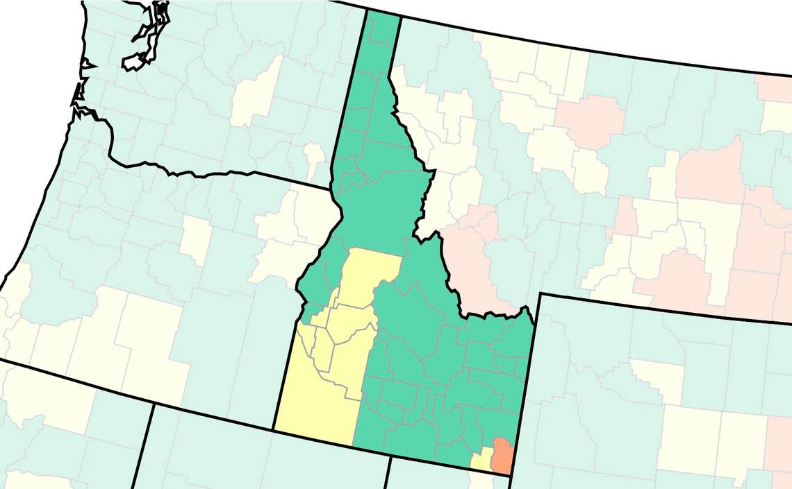 The U.S. Centers for Disease Control and Prevention’s COVID-19 community-level map by county, captured Friday. Green means low risk, yellow medium risk and red high risk.