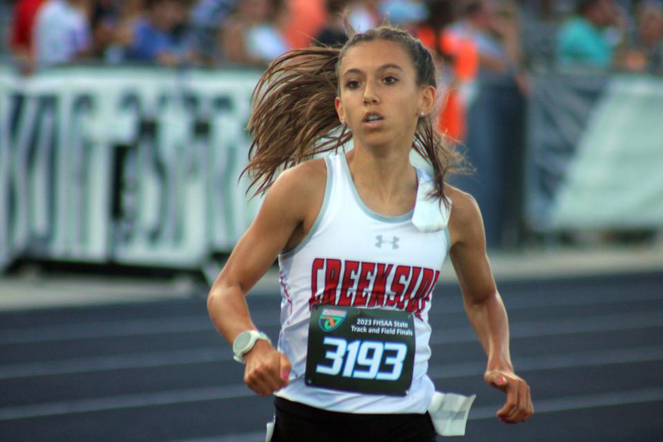 Alyson Johnson of Creekside races to victory in the girls 1,600-meter run  at the FHSAA Class 4A high school track and field championships in Jacksonville on May 20, 2023. [Clayton Freeman/Florida Times-Union]