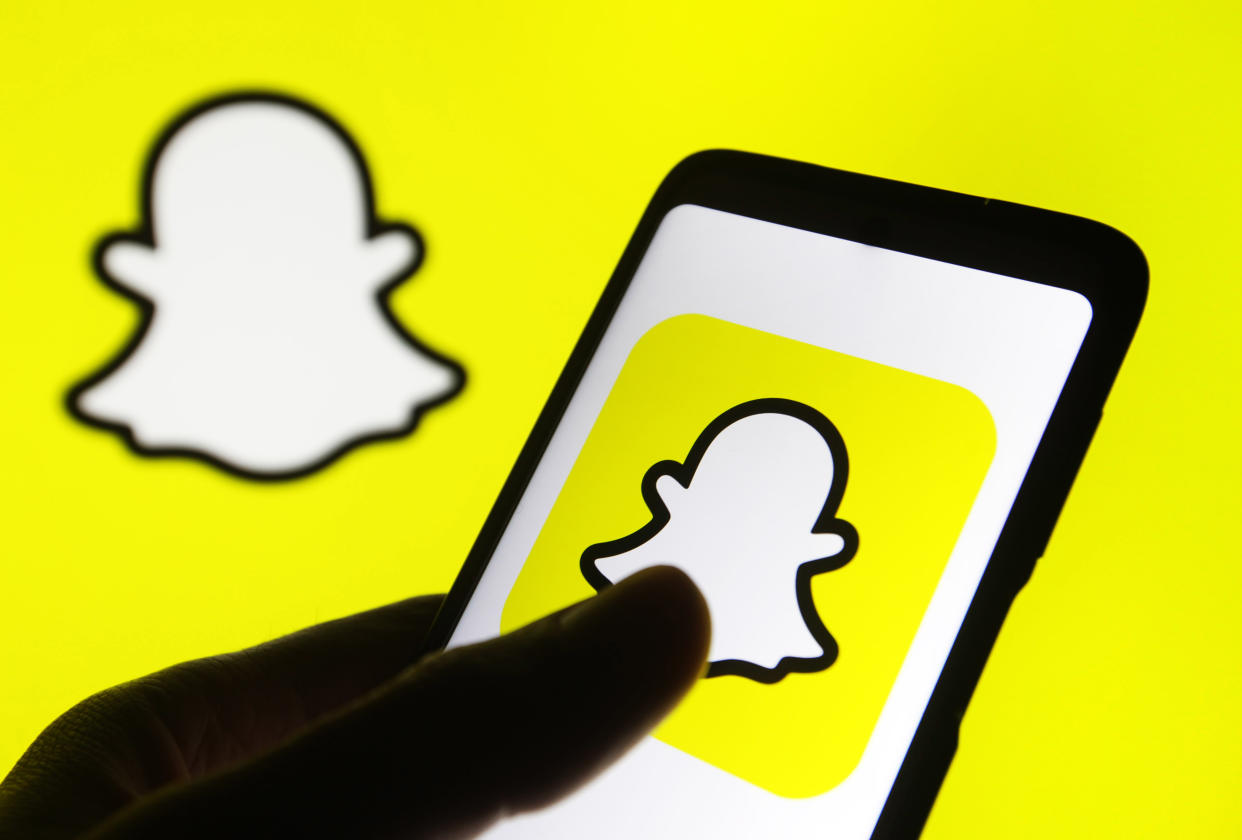 This illustration picture taken on 15 January 2021 shows the Snapchat logo displayed on a smartphone screen (Photo illustration by STR/NurPhoto via Getty Images)