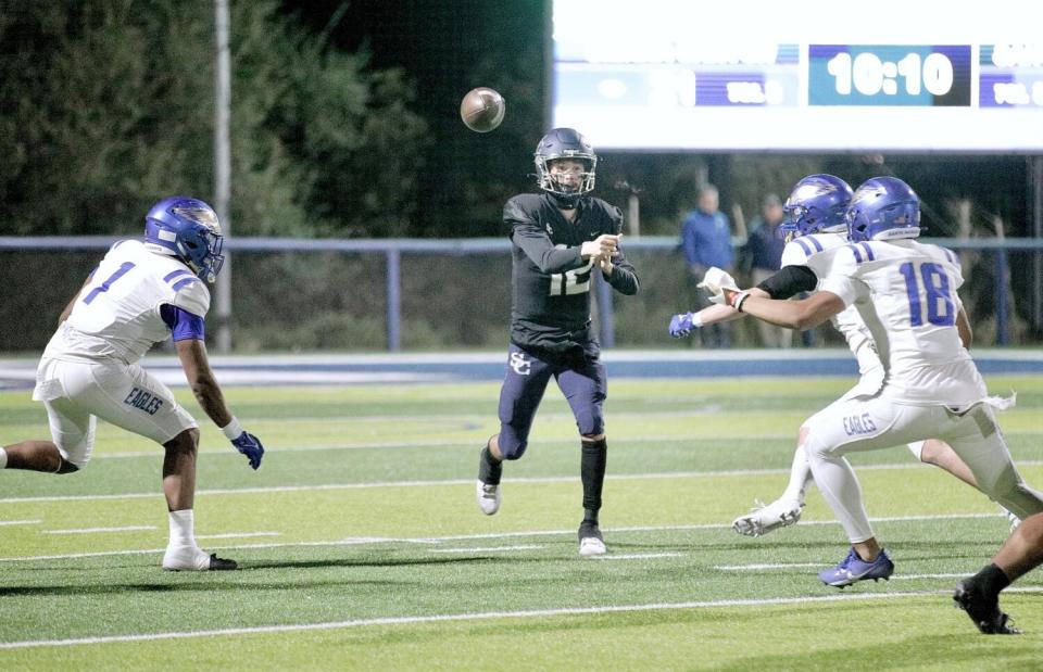 Sierra Canyon quarterback Wyatt Becker throws a pass from the pocket as three Santa Margarita defenders pressure him Friday.