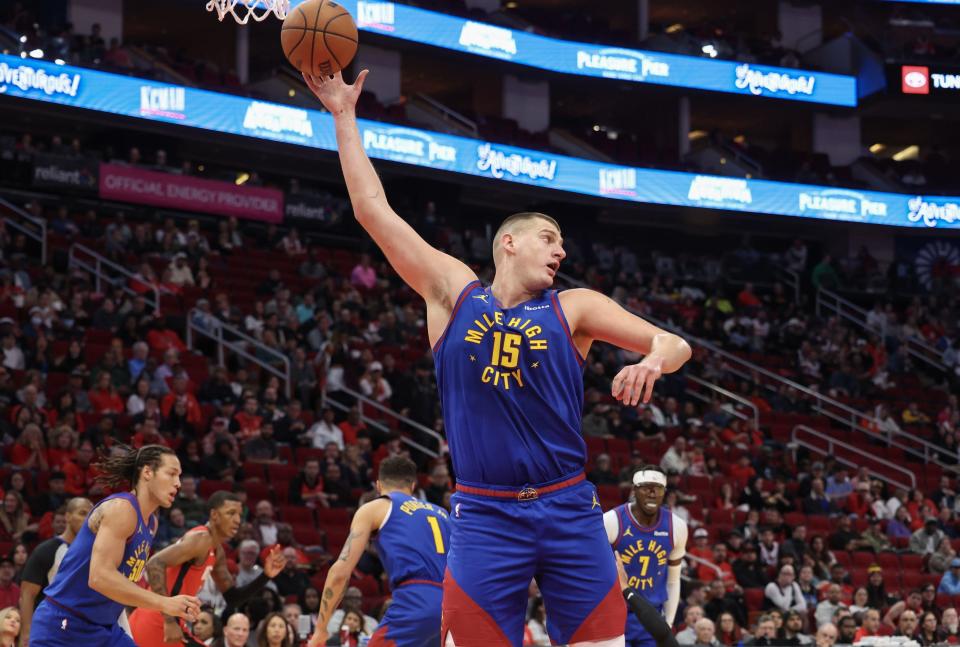 Nov 12, 2023; Houston, Texas, USA; Denver Nuggets center Nikola Jokic (15) grabs a defensive rebound against the Houston Rockets in the first quarter at Toyota Center. Mandatory Credit: Thomas Shea-USA TODAY Sports