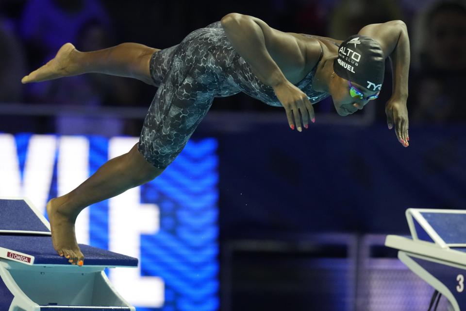 Simone Manuel participates in the women's 50 freestyle during wave 2 of the U.S. Olympic Swim Trials on Saturday, June 19, 2021, in Omaha, Neb. (AP Photo/Charlie Neibergall)