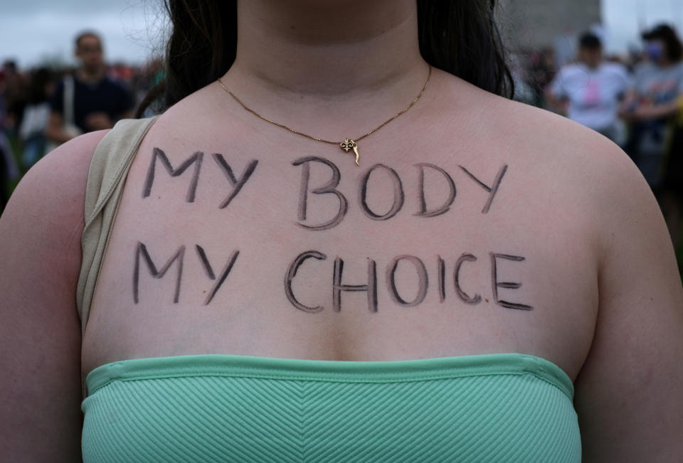 An abortion-rights demonstrator has the words 