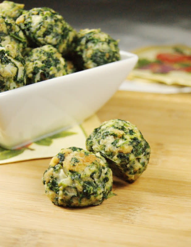 <p>The Kitchen Is My Playground</p><p>These cheesy spinach bites are perfect for your vegetarian friends. </p><p><strong>Get the recipe: <a href="https://www.thekitchenismyplayground.com/2011/07/spinach-balls.html" rel="nofollow noopener" target="_blank" data-ylk="slk:Spinach Balls;elm:context_link;itc:0;sec:content-canvas" class="link ">Spinach Balls</a></strong></p>