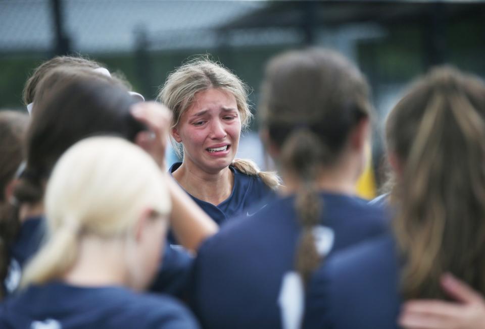 The Webster Thomas softball team reacts to losing the New York State Softball Championship semifinal to Troy on June 9, 2023. 