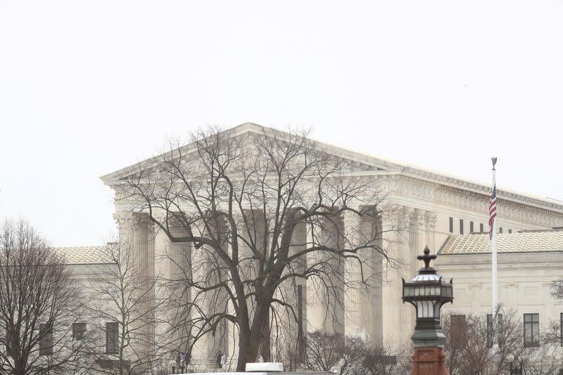 FILE PHOTO: Visitors walk along Supreme Court Plaza on Capitol Hill in Washington