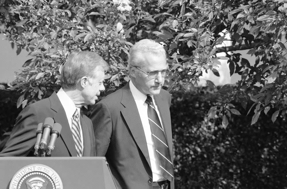 President Jimmy Carter says private word to newly sworn-in Housing and Urban Development Secretary Moon Landrieu, right, after the swearing-in ceremony in the Rose Garden at the White House in Washington, on Sept. 24, 1979. (AP Photo, File)