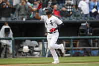 Chicago White Sox's Eloy Jimenez celebrates as he rounds the bases after hitting a solo home run off of Detroit Tigers' Edwin Jackson during the seventh inning of Game 1 of a baseball doubleheader, Saturday, Sept. 28, 2019, in Chicago. (AP Photo/Kamil Krzaczynski)