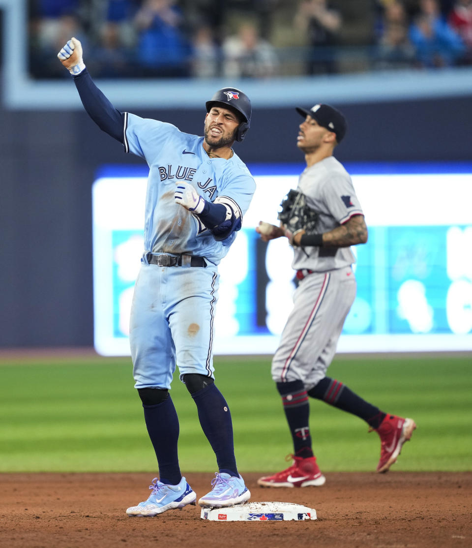 Toronto Blue Jays' George Springer celebrates a double against the Minnesota Twins during the ninth inning of a baseball game Friday, June 9, 2023, in Toronto. (Mark Blinch/The Canadian Press via AP)