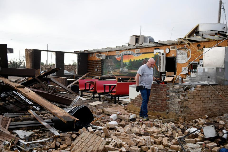 Pat Smith looks through his restaurant, Matador Diner, after a tornado in Matador, Texas. Smith was in the cafe during the tornado and said “it felt like forever but only lasted 20 seconds."