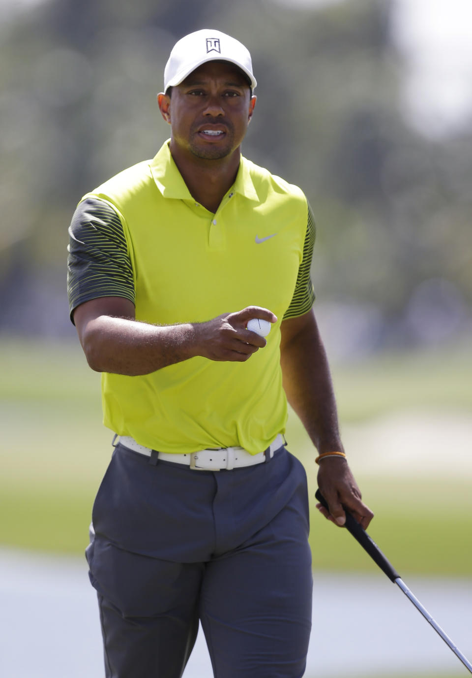 Tiger Woods holds the ball ball after making par on the 10th hole during the second round of the Cadillac Championship golf tournament Friday, March 7, 2014, in Doral, Fla. (AP Photo/Wilfredo Lee)