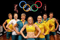 Australian Olympic athletes (L to R) Henry Frayne, Cate Campbel, Natalie Cook, Sally Pearson, Jessica Schipper, Mitchell Watt and Craig Mottram pose during the unveiling of the Australian Olympic team uniforms at Sydney Olympic Park on March 28, 2012. The London Olympics take place from July 27 to August 12. AFP PHOTO / MARK GUNTER (Photo credit should read Mark Gunter/AFP/Getty Images)