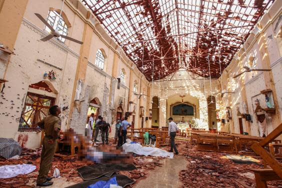 Victims of the Easter suicide bombings lie inside St Sebastian’s Church in Negombo (AP)