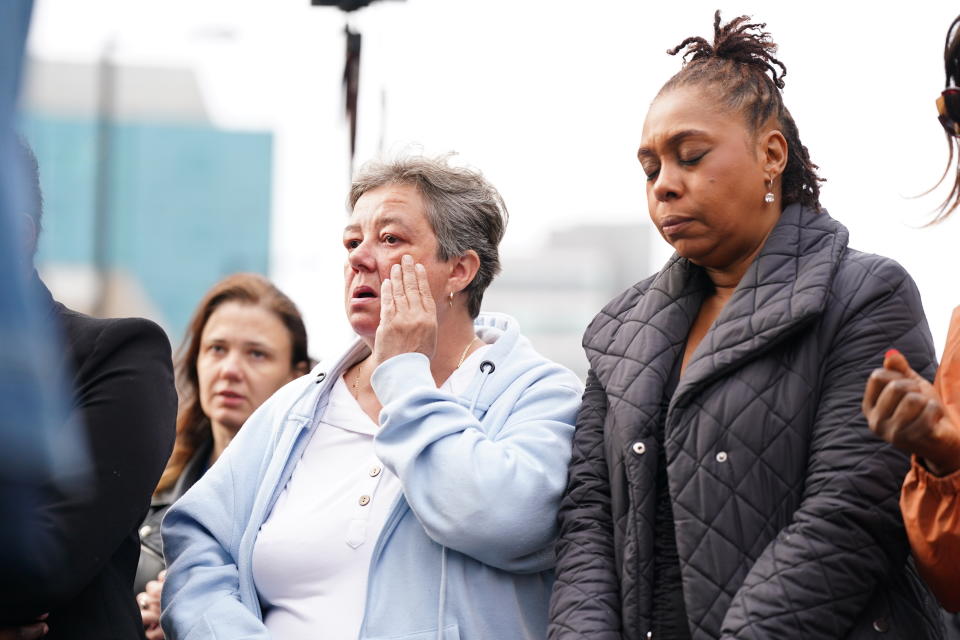 People attend a vigil in Croydon, south London, after 15-year-old Elianne Andam was stabbed to death on Wednesday morning. (PA)