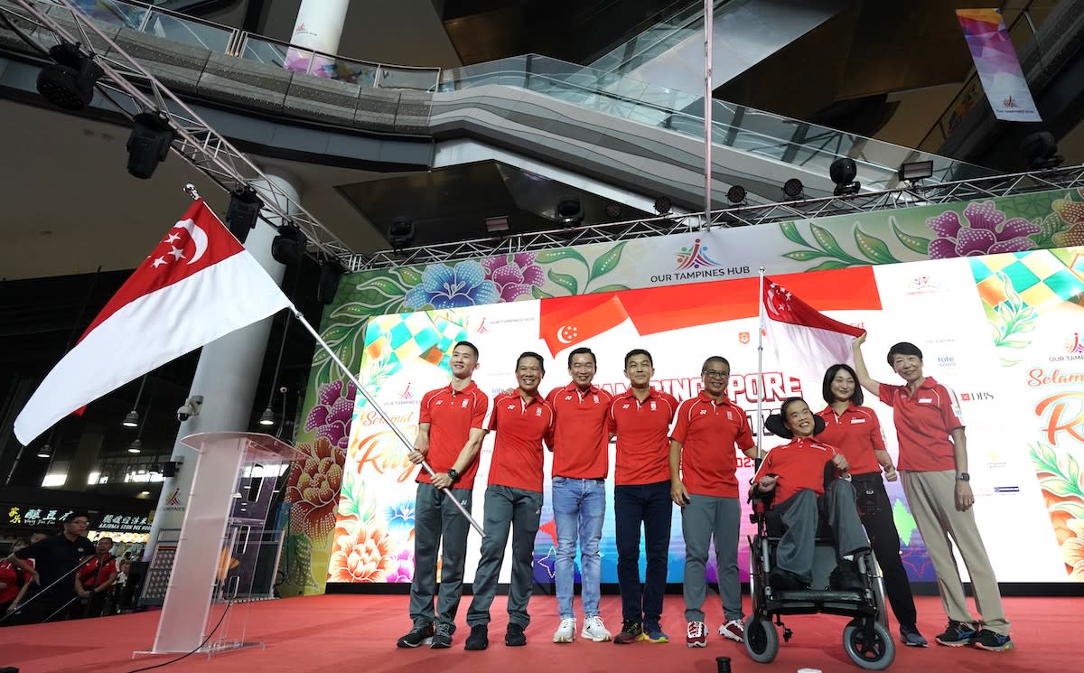 The 2023 SEA Games and ASEAN Para Games flag presentation ceremony at Our Tampines Hub, as flag bearers Terry Tay (left) and Toh Sze Ning (seated) were unveiled. (PHOTO: Lim Weixiang/SNOC)