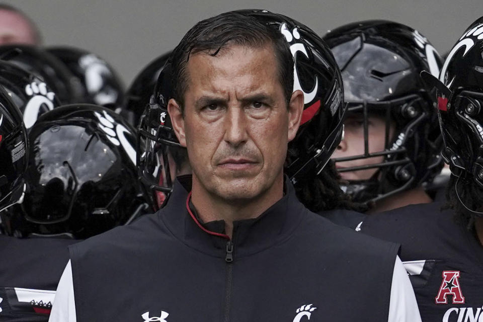 FILE - Cincinnati head coach Luke Fickell prepares to take players onto the field prior to an NCAA college football game against Miami (Ohio) Saturday, Sept. 4, 2021, in Cincinnati. For Cincinnati (13-0), a member of the second-tier American Athletic Conference, the planets aligned. The Bearcats landed as the No. 4 seed in the CFP, invading the domain of college football's blue bloods. (AP Photo/Jeff Dean, File)