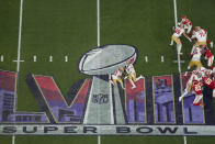 San Francisco 49ers quarterback Brock Purdy, center right, hands the ball over to running back Elijah Mitchell (25) during overtime of the NFL Super Bowl 58 football game against the Kansas City Chiefs Sunday, Feb. 11, 2024, in Las Vegas. (AP Photo/Godofredo A. Vásquez)