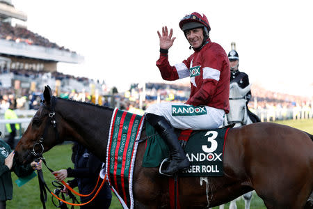 Horse Racing - Grand National Festival - Aintree Racecourse, Liverpool, Britain - April 6, 2019 Davy Russell celebrates on Tiger Roll after winning the 5.15 Randox Health Grand National Handicap Chase Action Images via Reuters/Paul Childs