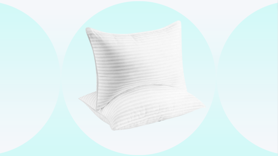 a pair of beckham hotel pillows on a teal and white background