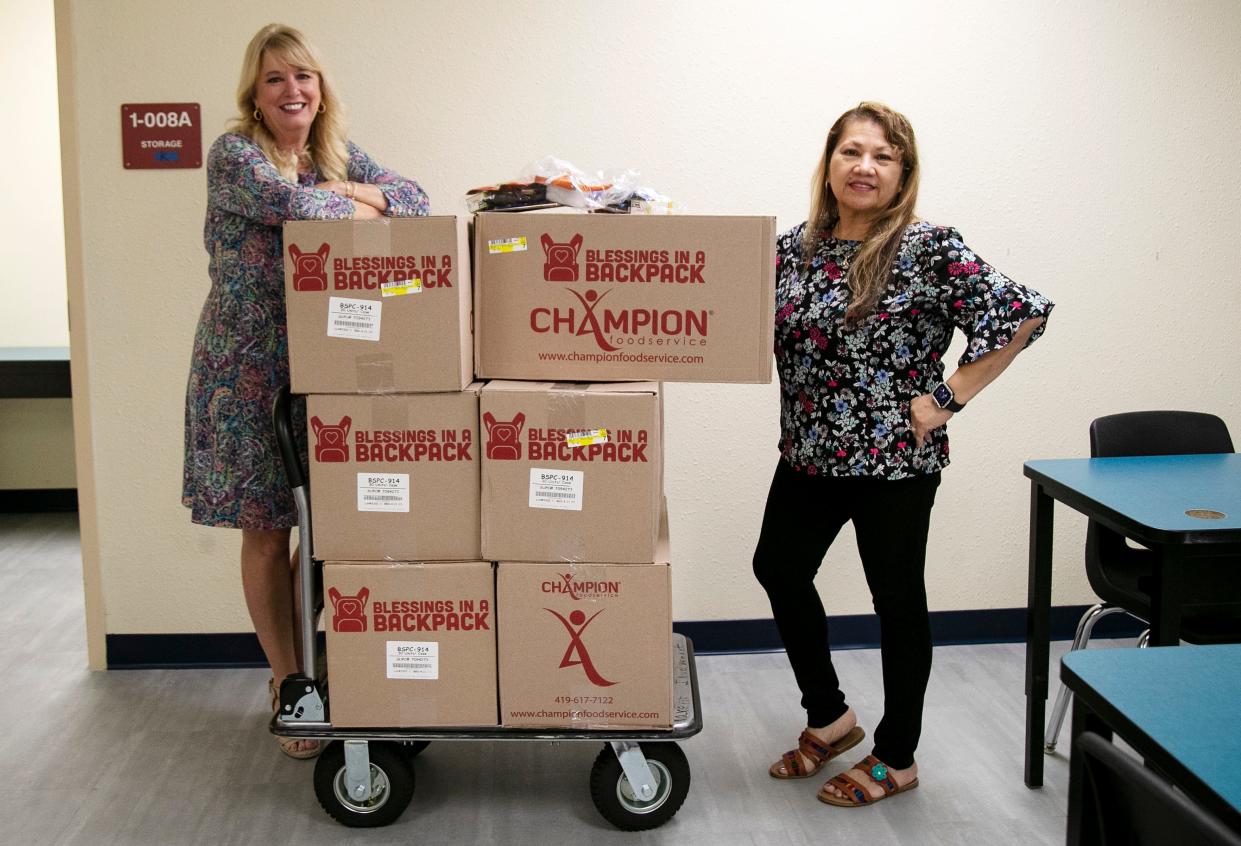 Cecilia St. Arnold, the Executive Director of Blessings in a Backpack of SWFL,  and Yasmin Gallo, right,  the Tice Elementary Program Coordinator show the boxes of food to be distributed to Tice Elementary School students on Thursday, Feb. 2, 2023, in Fort Myers. 