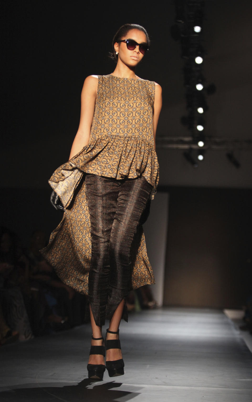 A model displays an outfit by designer Jewel by Lisa of Nigeria at the ARISE Fashion Week event in Lagos, Nigeria on Sunday, March 11, 2012. (AP Photos/Sunday Alamba)