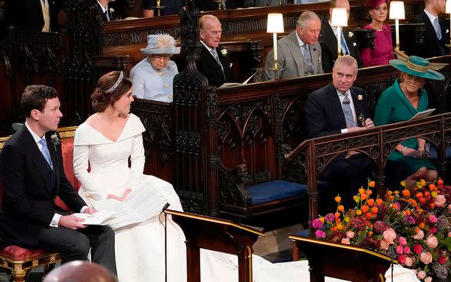 <p>DANNY LAWSON/AFP via Getty</p> Queen Elizabeth wears blue at Princess Eugenie's wedding in 2018